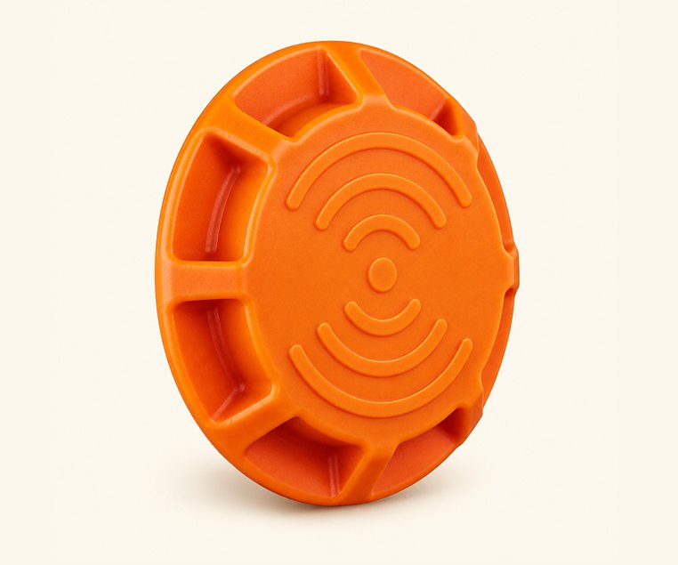 An orange ROTO-iD industrial RFID tag.